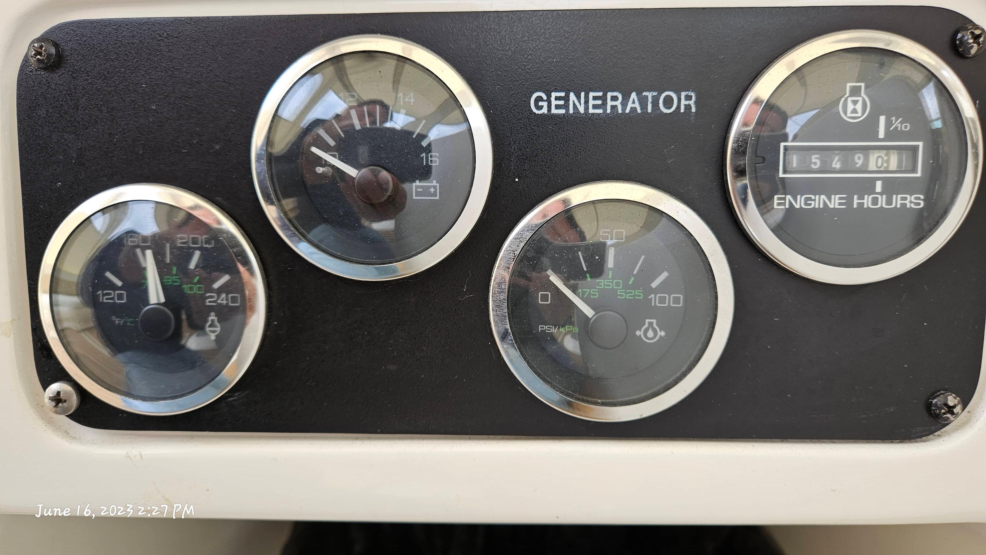 Slide: The Image of Close-up of generator gauges on a 1999 Sea Ray 540 Sundancer boat. - 37