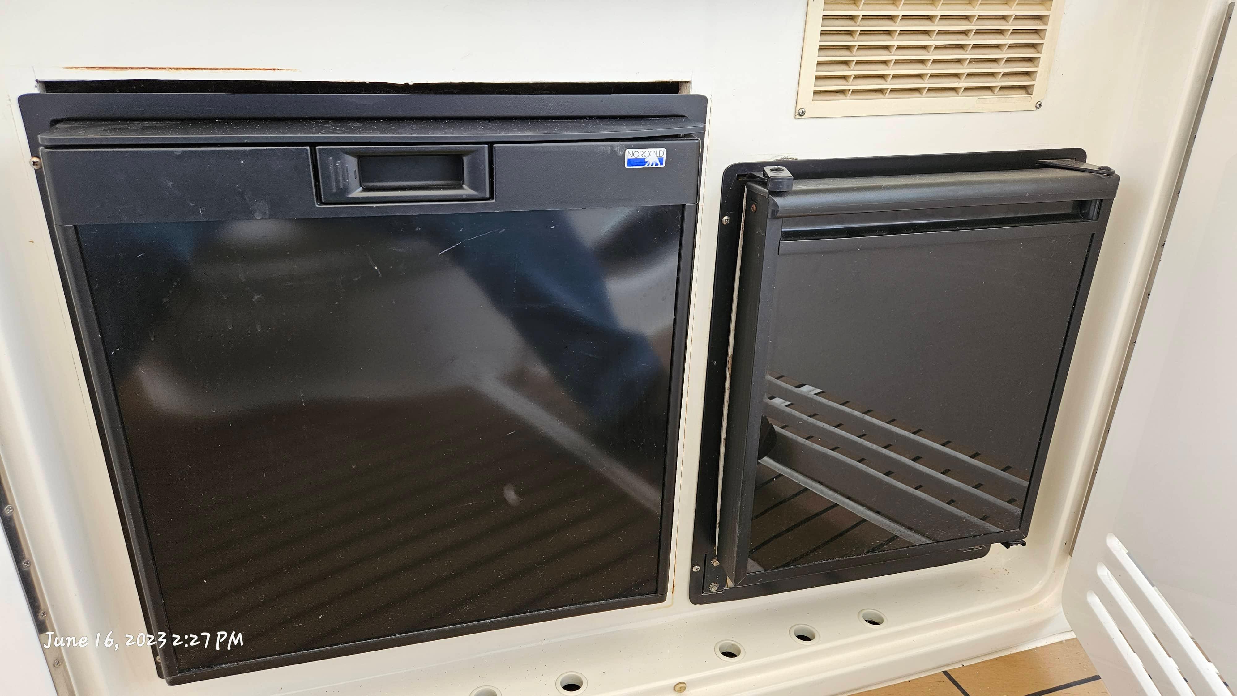 Slide: The Image of Black refrigerator and freezer on a 1999 Sea Ray 540 Sundancer boat. - 38