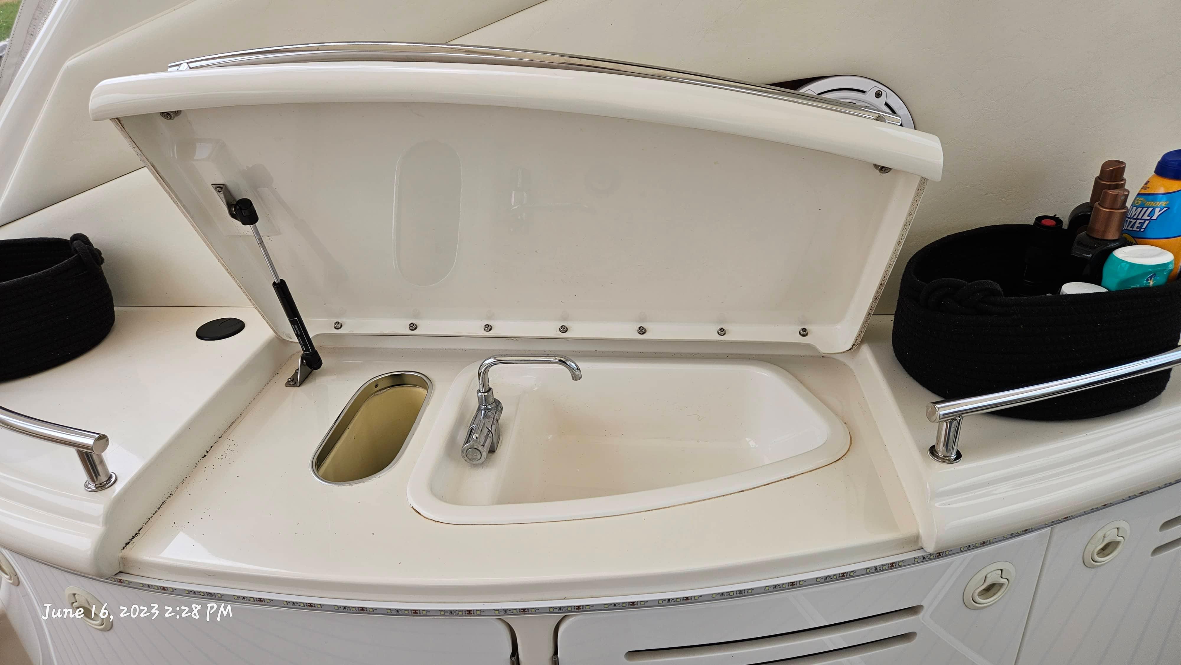 Slide: The Image of 1999 Sea Ray 540 Sundancer yacht sink and countertop with storage baskets. - 40