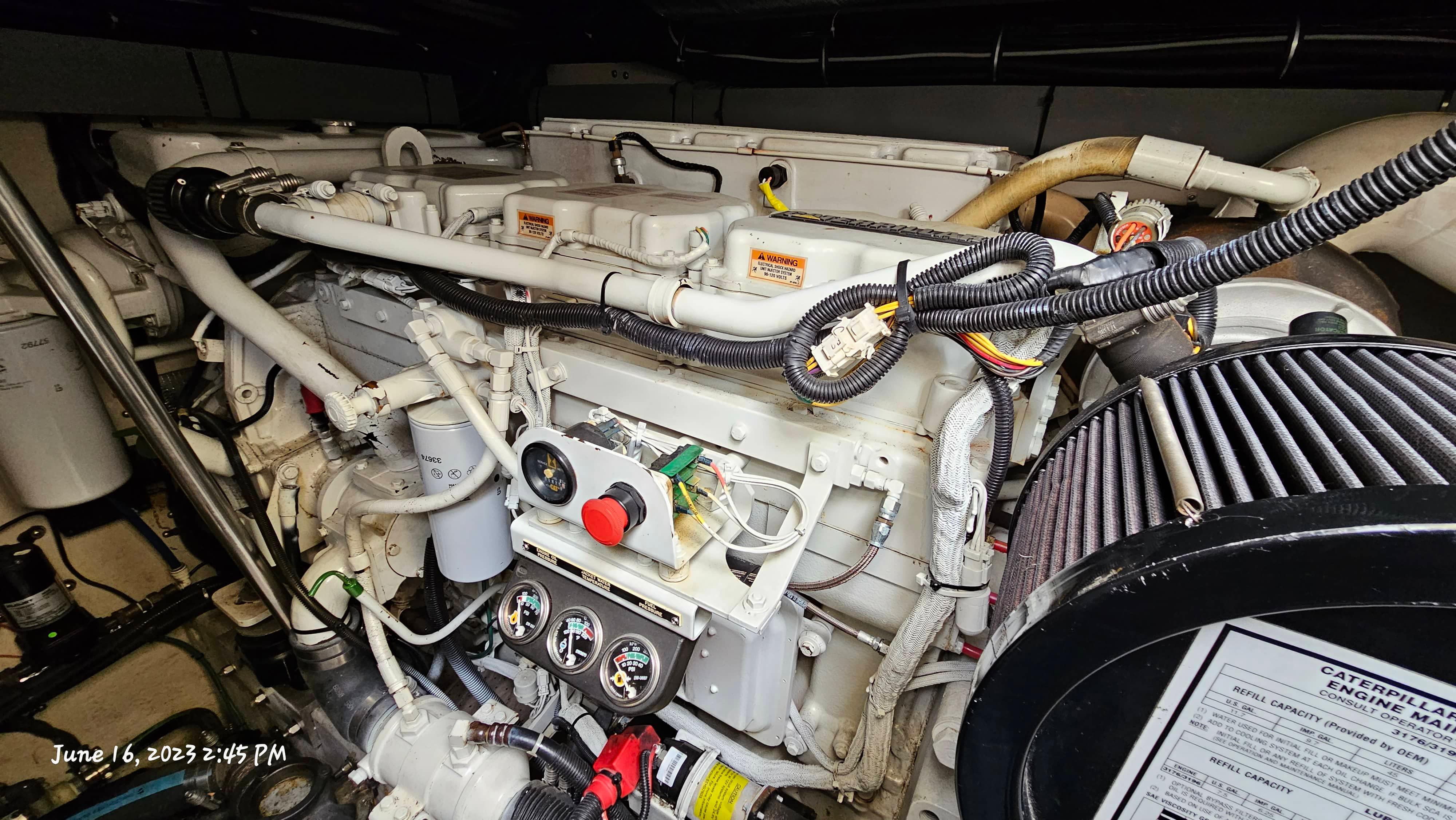 Slide: The Image of Engine compartment of a 1999 Sea Ray 540 Sundancer yacht, featuring detailed machinery. - 42