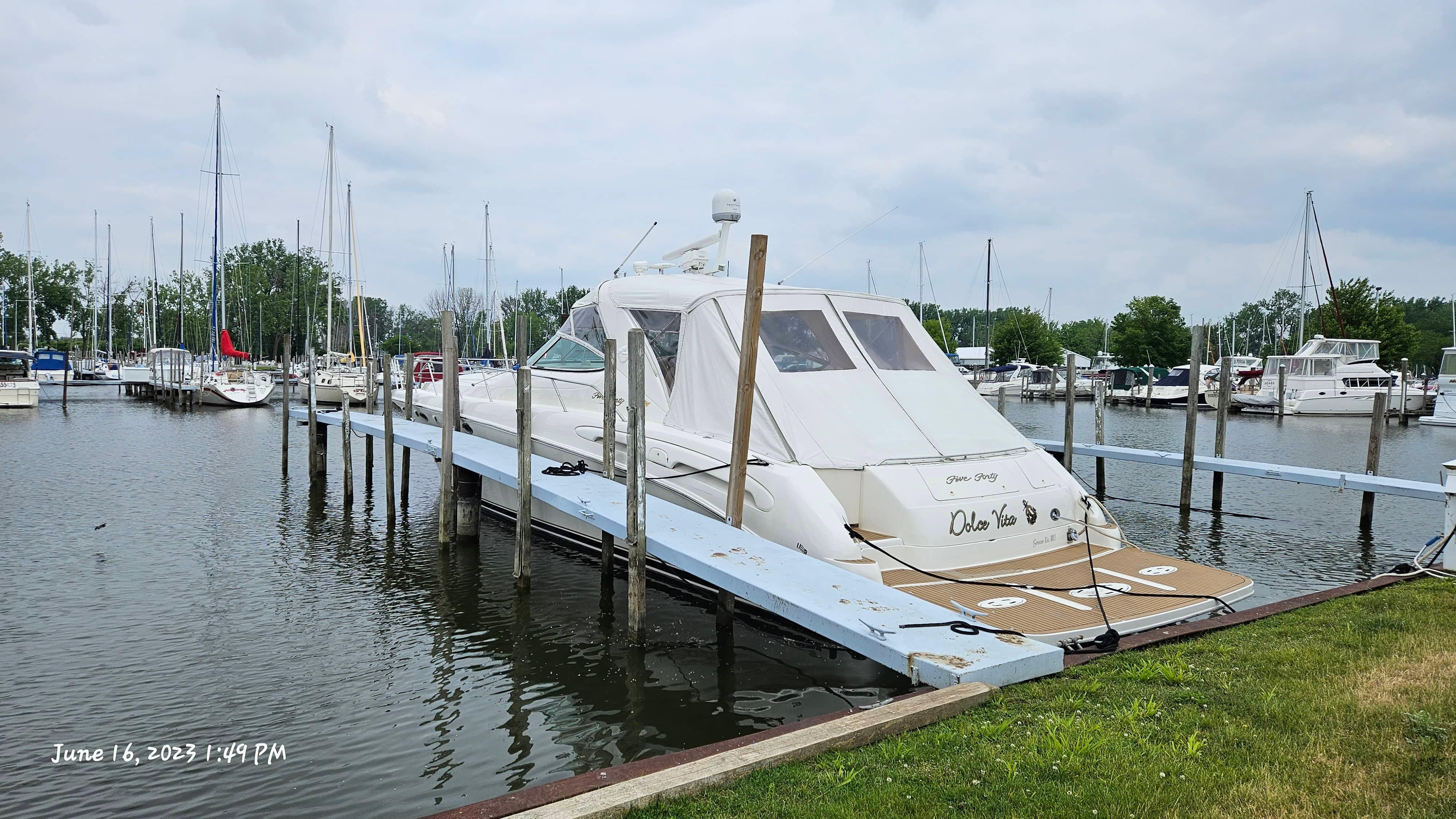 Slide: The Image of Sea Ray 540 Sundancer 1999 yacht docked at a marina, June 16, 2023. - 5