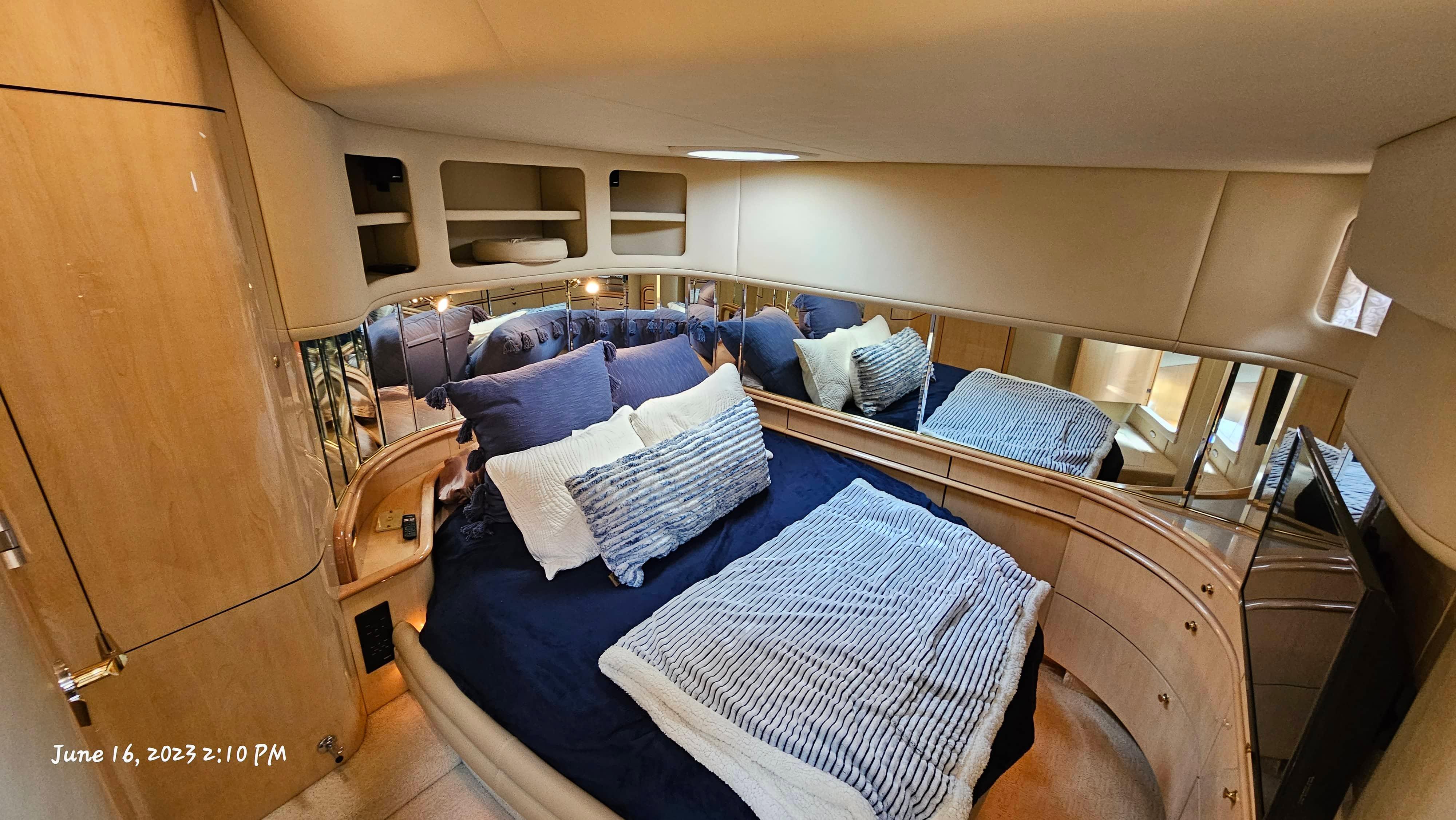 Slide: The Image of Luxurious bedroom interior of a 1999 Sea Ray 540 Sundancer yacht with cozy bedding. - 8