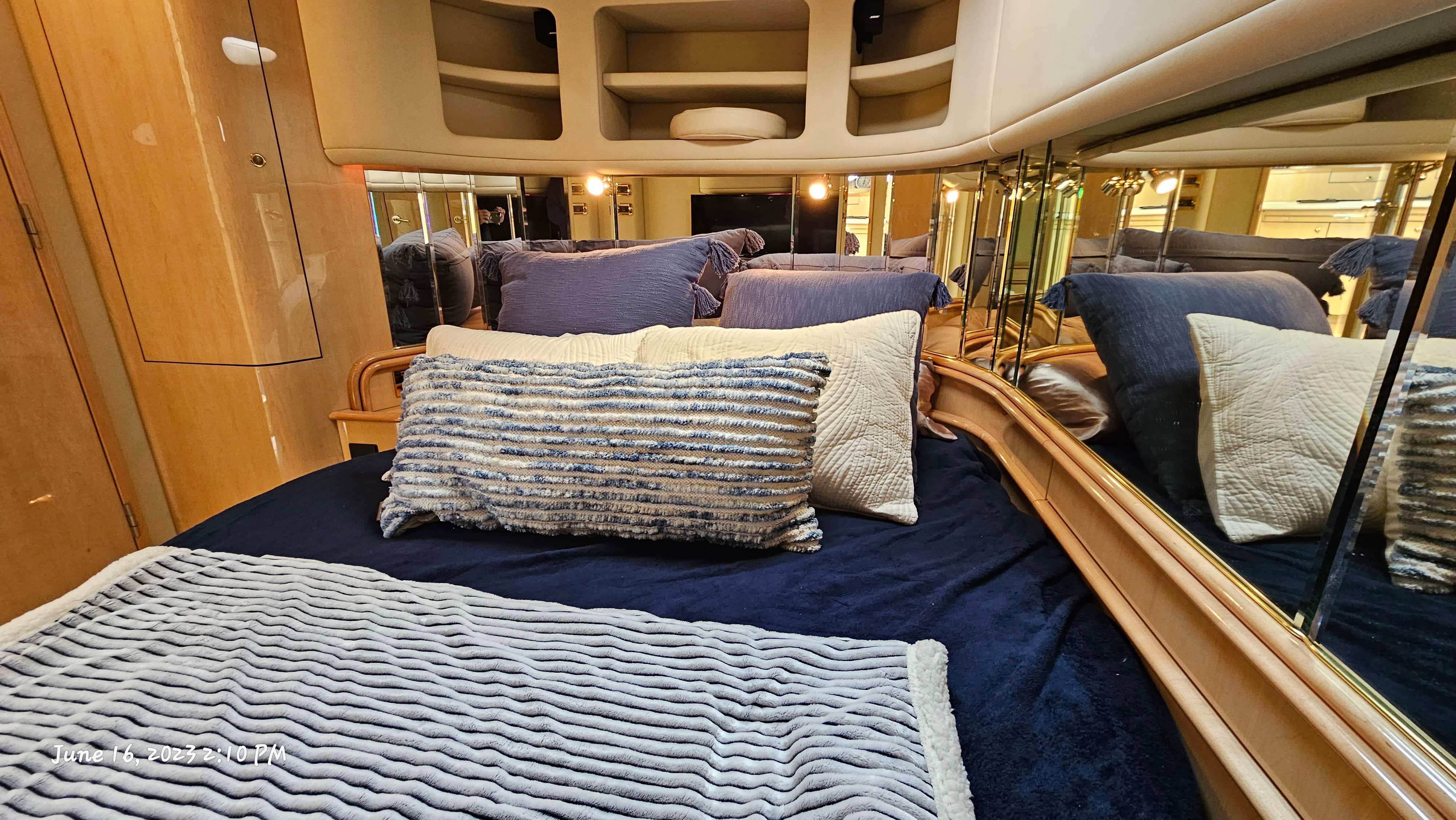 Slide: The Image of Luxurious bedroom interior of 1999 Sea Ray 540 Sundancer yacht with plush pillows and cozy bedding. - 9