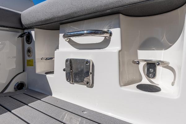 Slide: The Image of 2021 Sea Ray SDX 250 boat interior with stainless steel fixtures and seating. - 16