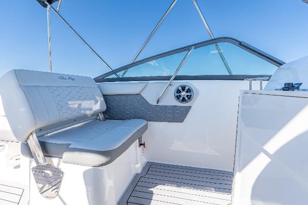 Slide: The Image of 2021 Sea Ray SDX 250 boat interior with gray seating and sleek design. - 17