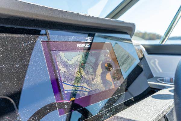 Slide: The Image of Simrad navigation display on 2021 Sea Ray SDX 250 boat dashboard. - 21