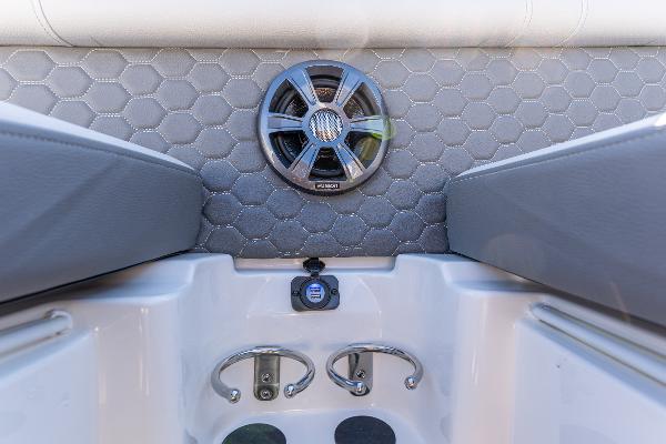 Slide: The Image of 2021 Sea Ray SDX 250 boat interior with speaker and cup holders. - 26