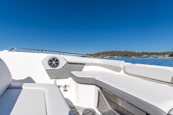Slide: The Image of 2021 Sea Ray SDX 250 boat interior with white seating and blue sky background. - 27