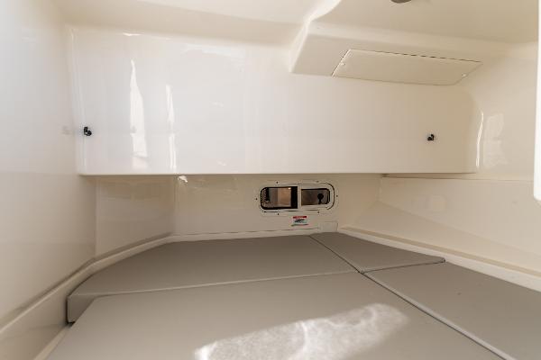 Slide: The Image of Interior cabin of 2021 Sea Ray SDX 250 boat, featuring sleek white design. - 28