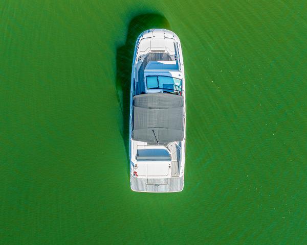 Slide: The Image of Aerial view of 2021 Sea Ray SDX 250 boat on green water. - 8