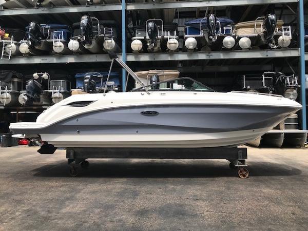 Slide: The Image of 2025 Sea Ray SDX 250 boat in storage facility, side view. - 0