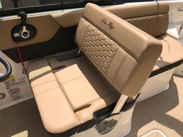 Slide: The Image of 2025 Sea Ray SDX 250 boat interior with tan leather seating and elegant design. - 12
