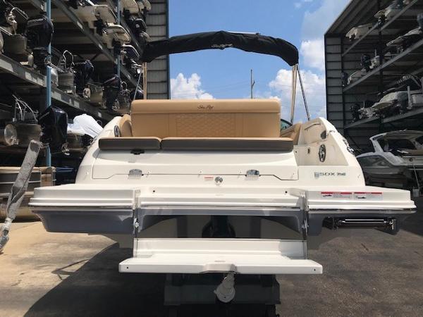 Slide: The Image of 2025 Sea Ray SDX 250 boat rear view in storage facility. - 2