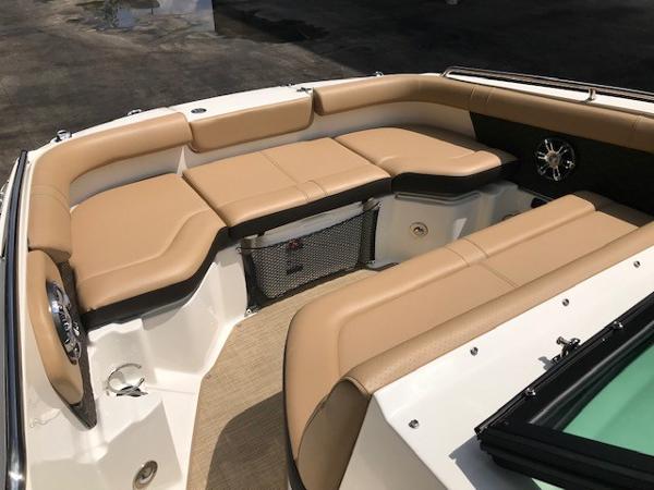Slide: The Image of 2025 Sea Ray SDX 250 boat interior with tan seating and storage. - 20