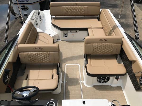 Slide: The Image of 2025 Sea Ray SDX 250 boat interior with tan leather seating and modern design. - 24