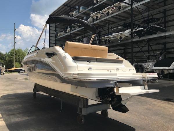 Slide: The Image of 2025 Sea Ray SDX 250 boat in storage, rear view, sunny day. - 3