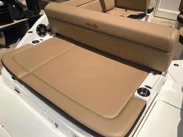 Slide: The Image of 2025 Sea Ray SDX 250 boat with tan leather seating and cup holders. - 7