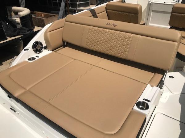 Slide: The Image of 2025 Sea Ray SDX 250 boat with tan leather seating and cup holders. - 8