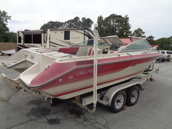 Slide: The Image of 1988 Sea Ray Seville 20 Bow Rider on trailer, red and white exterior. - 13