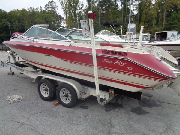Slide: The Image of 1988 Sea Ray Seville 20 Bow Rider on a trailer in a marina. - 15