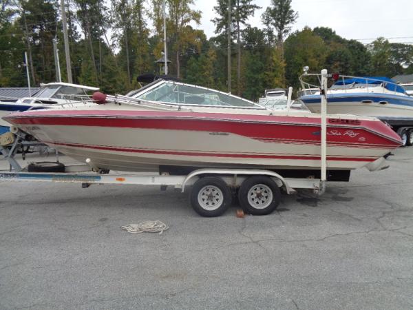 Slide: The Image of 1988 Sea Ray Seville 20 Bow Rider on a trailer in a marina. - 16