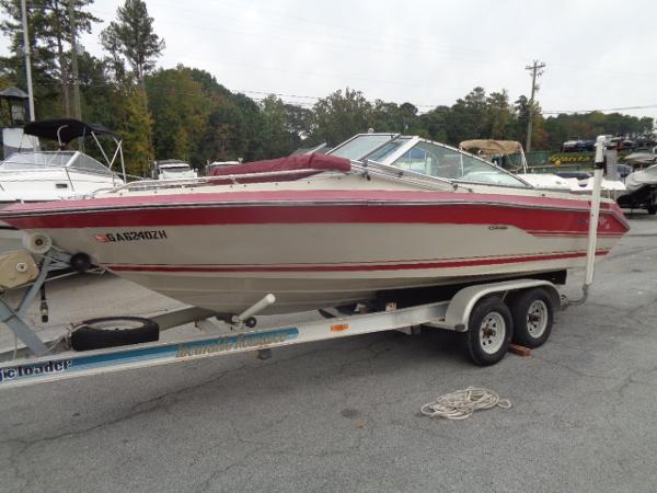 Slide: The Image of 1988 Sea Ray Seville 20 Bow Rider on a trailer in a marina. - 17