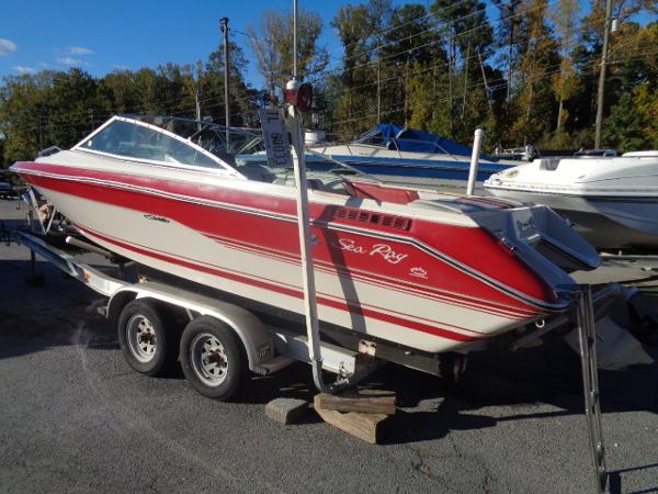 Slide: The Image of 1988 Sea Ray Seville 20 Bow Rider on a trailer in a boatyard. - 2