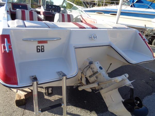 Slide: The Image of 1988 Sea Ray Seville 20 Bow Rider, rear view with outboard motor and seating. - 21