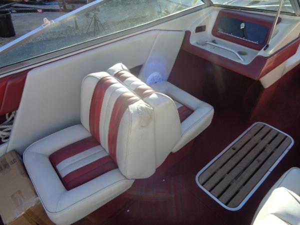 Slide: The Image of 1988 Sea Ray Seville 20 Bow Rider interior with red and white seats. - 24