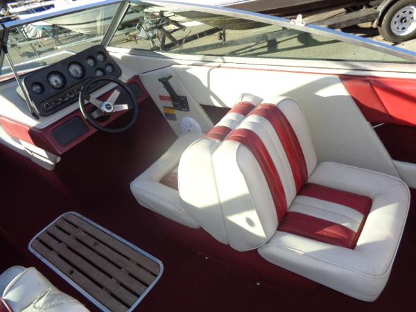 Slide: The Image of 1988 Sea Ray Seville 20 Bow Rider interior with red and white seats. - 26