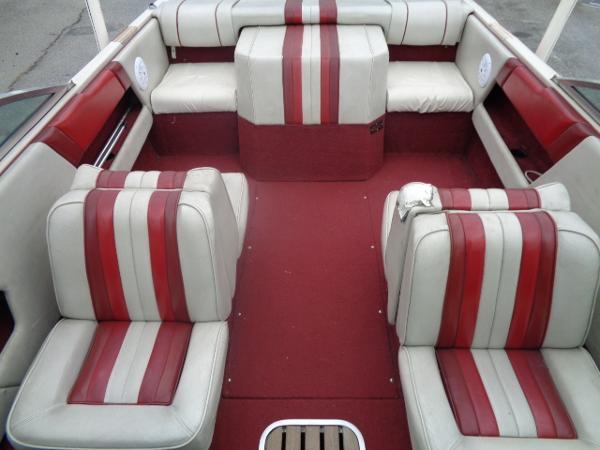 Slide: The Image of 1988 Sea Ray Seville 20 Bow Rider interior with red and white striped seating. - 28
