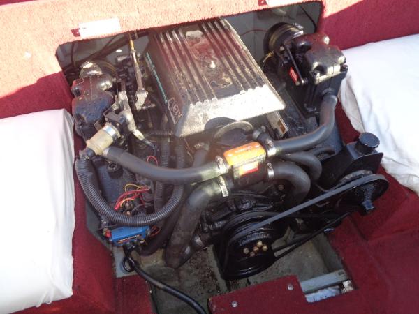 Slide: The Image of 1988 Sea Ray Seville 20 Bow Rider engine compartment with visible engine components. - 29