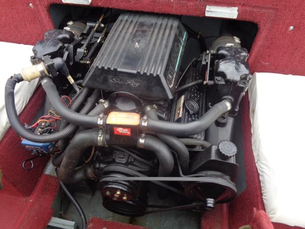 Slide: The Image of 1988 Sea Ray Seville 20 Bow Rider engine compartment with visible engine components. - 7