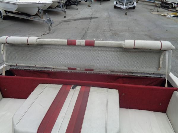 Slide: The Image of 1988 Sea Ray Seville 20 Bow Rider interior with red and white seating. - 8