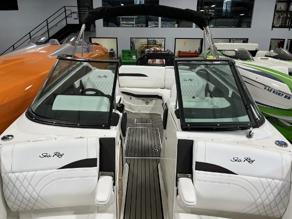 Slide: The Image of 2024 Sea Ray SLX 260 boat interior with white seating and black accents. - 64