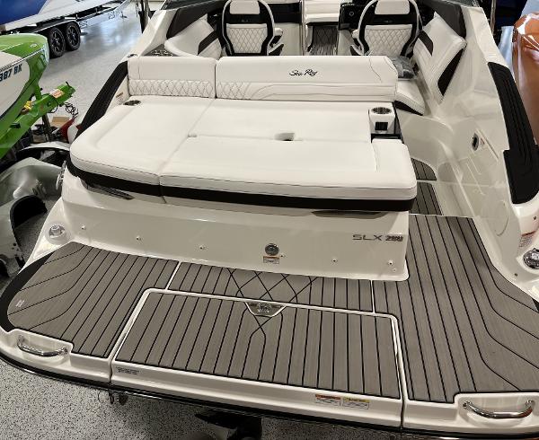 Slide: The Image of 2024 Sea Ray SLX 260 boat with luxurious seating and spacious deck. - 76