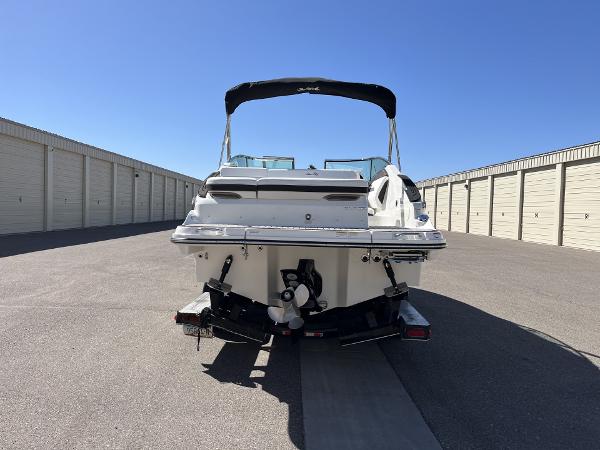 Slide: The Image of 2024 Sea Ray SLX 260 boat in storage facility, rear view. - 82