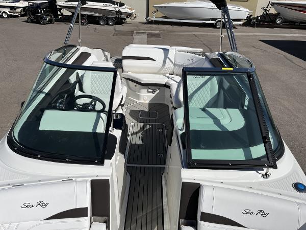 Slide: The Image of 2024 Sea Ray SLX 260 boat interior with white seating and black trim. - 84