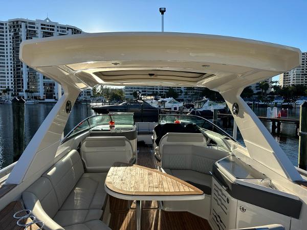 Slide: The Image of 2021 Sea Ray SLX 310 OB luxury boat interior at marina. - 19