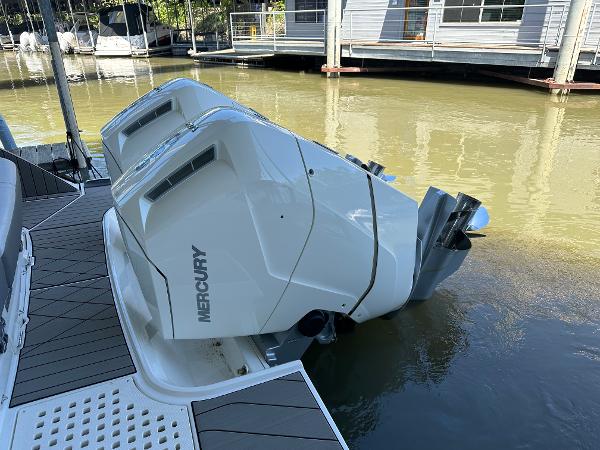 Slide: The Image of 2023 Sea Ray SLX 400 OB with twin Mercury outboard engines docked. - 4