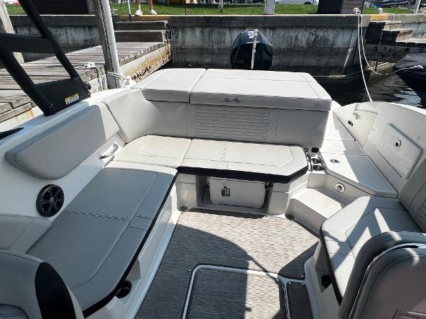 Slide: The Image of 2021 Sea Ray SPO 230 boat interior with spacious seating and modern design. - 2