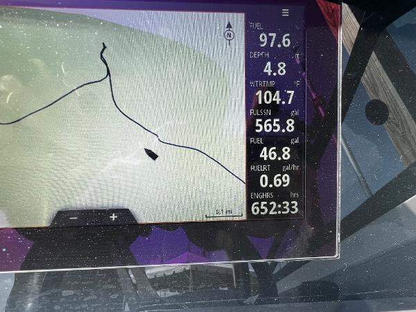Slide: The Image of Boat navigation display showing fuel, depth, and engine hours for 2021 Sea Ray SPO 230. - 6