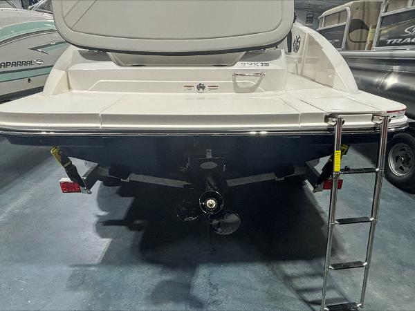 Slide: The Image of 2024 Sea Ray 210 SPX boat rear view with swim platform and ladder. - 11