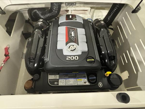 Slide: The Image of 2024 Sea Ray 210 SPX boat engine compartment with a 200 HP Mercury engine. - 5