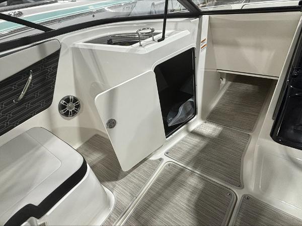 Slide: The Image of Interior of 2024 Sea Ray 210 SPX boat with open storage compartment. - 6