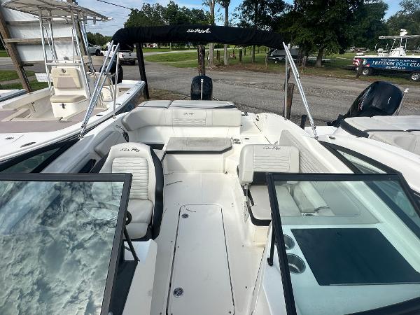 Slide: The Image of 2021 Sea Ray SPX 210 OB boat interior with seating and windshield. - 10