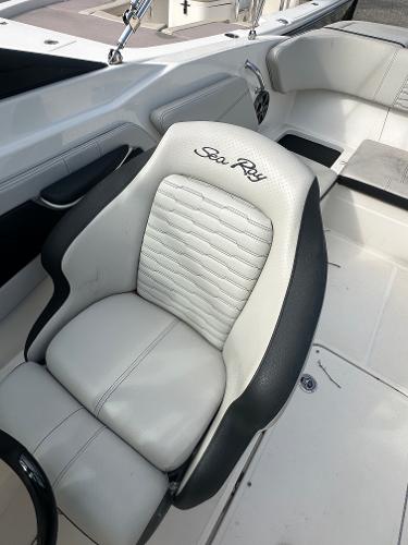 Slide: The Image of 2021 Sea Ray SPX 210 OB boat interior with white and black seating. - 13