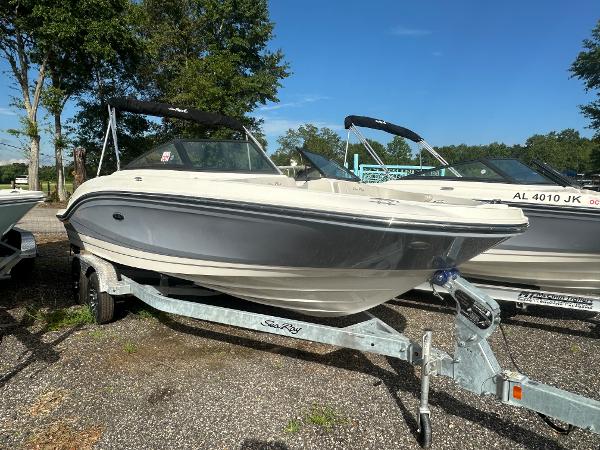Slide: The Image of 2021 Sea Ray SPX 210 OB boat on a trailer, parked outdoors. - 4