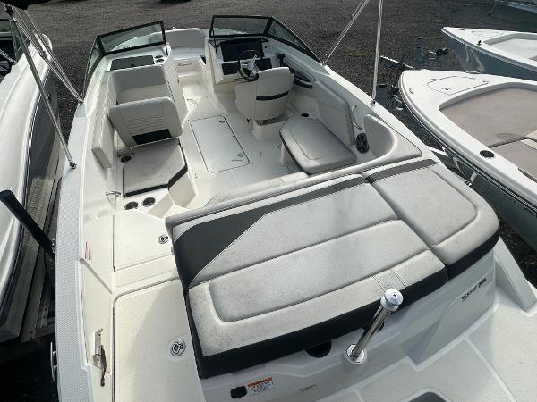 Slide: The Image of 2021 Sea Ray SPX 210 OB boat interior with seating and steering console. - 6