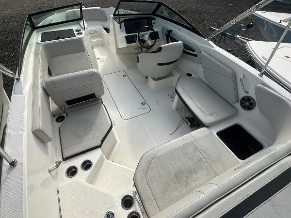 Slide: The Image of 2021 Sea Ray SPX 210 OB boat interior with white seating and steering console. - 8